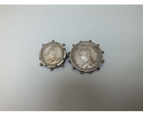 A VICTORIAN FLORIN BROOCH, the coin dated 1887, set in a moulded white metal surround, pin fastener, together with a similar 