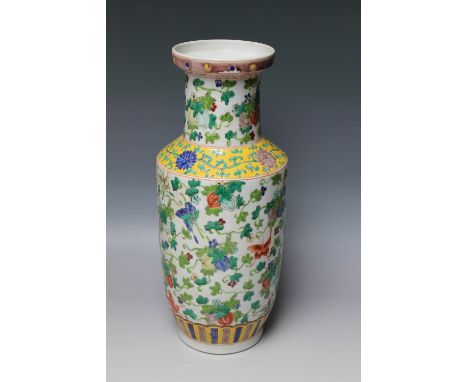 A CHINESE PORCELAIN BALUSTER VASE, decorated with flowers and butterflies, bearing six character mark to the base, possibly f