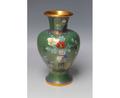 A CHINESE CLOISONNE ENAMEL VASE, green ground with cloud decoration, with central design of a vase of flowers on stand, with 