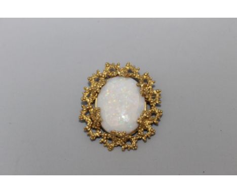 A LARGE OPAL BROOCH IN A BESPOKE NATURALISTIC 18 CARAT GOLD MOUNT, the oval opal measurses 3 cm by 2.25 cm, A/FCondition Repo