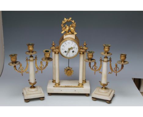 A FRENCH WHITE MARBLE PORTICO CLOCK GARNITURE, the drum head clock movement raised on four columns, with Arabic numerals and 