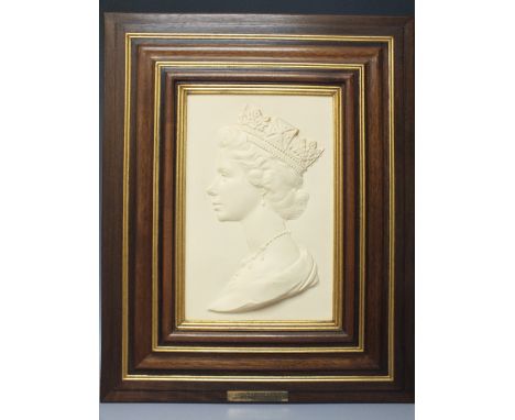 A ROYAL WORCESTER FRAMED CERAMIC PLAQUE OF H.M. QUEEN ELIZABETH II, modelled by Arnold Machin O.B.E. R.A., limited edition nu