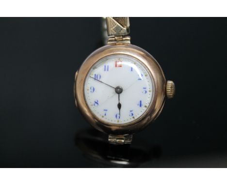 A LADIES 9CT GOLD ROLEX, import hallmarks for London 1913, white enamel dial, with blue Arabic numeral markers and red twelve