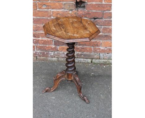 A 19TH CENTURY ROSEWOOD OCTAGONAL TABLE, the octagonal top raised on a barleytwist column and carved tripod support, H 67 cm,