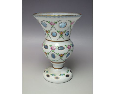 A 20TH CENTURY BLUE GLASS BOHEMIAN OVERLAY VASE, the white overlay with enamel painted flowers and cut decoration, H 21.2 cm