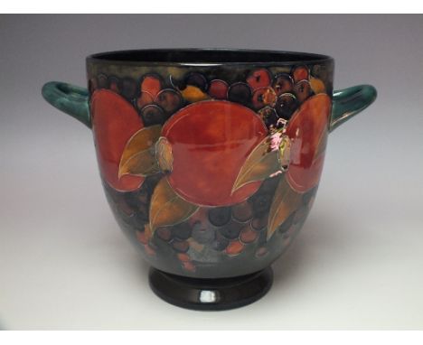 AN UNUSUAL TWIN HANDLED MOORCROFT POMEGRANATE VASE, gloss finish, tubelined decoration, painted signature marks to base, H 22