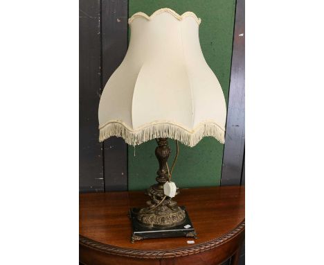 A modern brass desk lamp with green glass shade, together with a gilt metal rococo style table lamp upon a shaped marble base