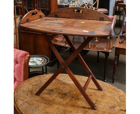 An Edwardian mahogany butlers tray on stand, 71cm by 48cm by 81cmScuffs and scratches to the polish throughout, heavy waterma