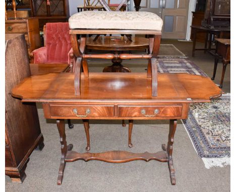 A reproduction mahogany sofa table, 145cm (open) by 57cm by 74cm, together with an X form stool (2)