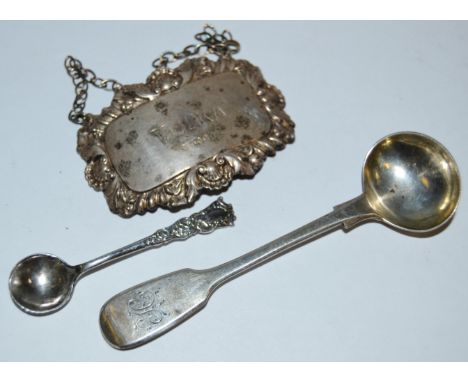 An Elizabeth II silver decanter label, Vodka, London 1971; an early Victorian Provincial mustard spoon, Exeter 1846; a salt s