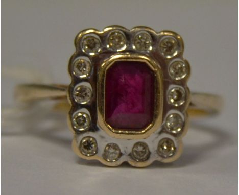 A 9ct gold emerald cut ruby and diamond cluster ring, rub over setting, hallmarked, size M 1/2, gross weight 4.1g