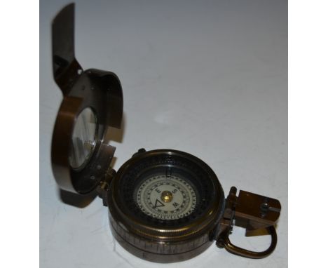 Militaria - a World War II marching compass, by TG Co Ltd, dated 1941