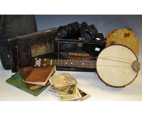 Ephemera - a cased George Formby ukulele (faults), tambourine; a pair of Zenith binoculars; a metal Paragon First Aid Case; a