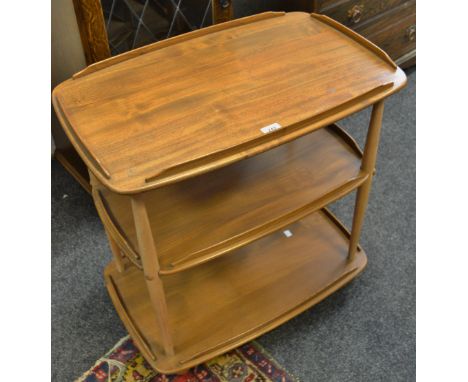 An Ercol blonde pebble three tier tea trolley