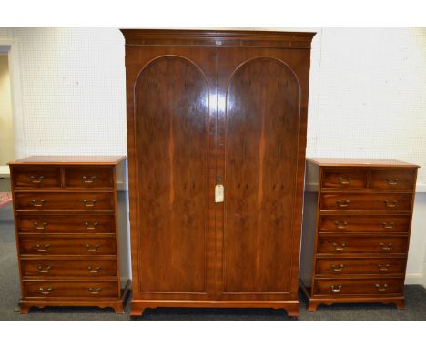 A pair of contemporary chest of drawers, two short cockbeaded drawers, above five long, ebony stringing throughout, brass dro