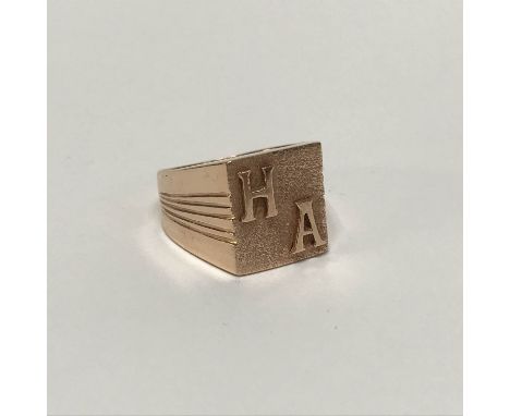 A gold coloured ring, stamped '18', weight 6.9g