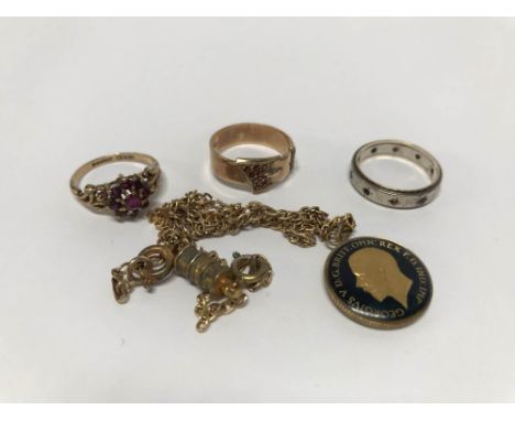 Two 9ct gold dress rings, total weight 5.6g, a 9ct silver eternity ring and a necklace stamped '375'