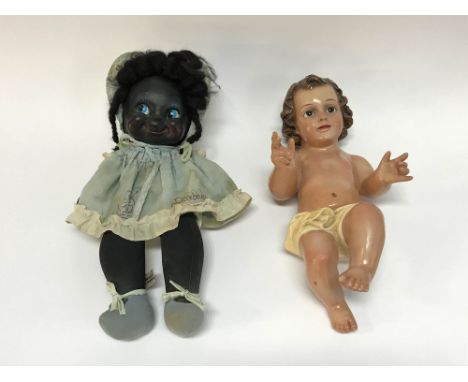 A vintage cloth doll with plastic face, with label 'Handmade in Barbados by Zonka Products', 41cm L and a reclined plaster mo