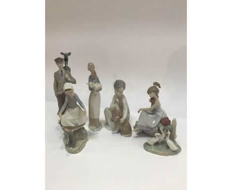 Five Lladro figures and a group of Nao ducks