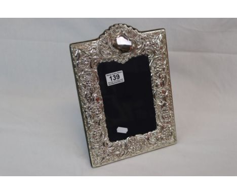 A hallmarked silver easel back photograph frame.