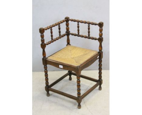 Early 20th century Oak Corner Chair with Bobbin Supports and Rush Seat