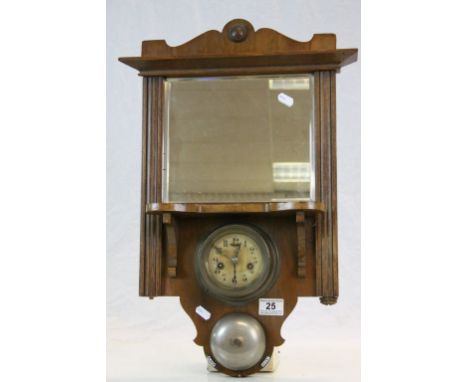 Oak framed bevelled glass wall Mirror, set with key wind German Alarm clock &amp; Bell, measures approx 56 x 38cm at the wide