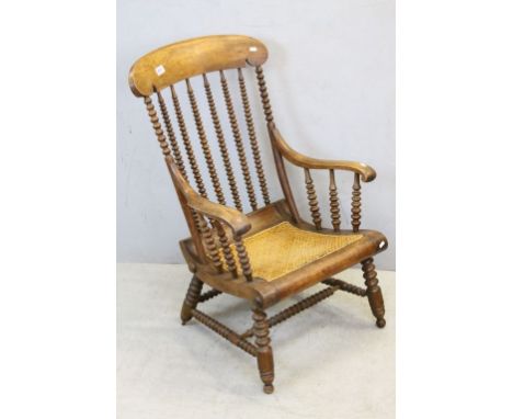 19th century Lathe Back Elbow Chair with Bobbin Supports and Cane Seat