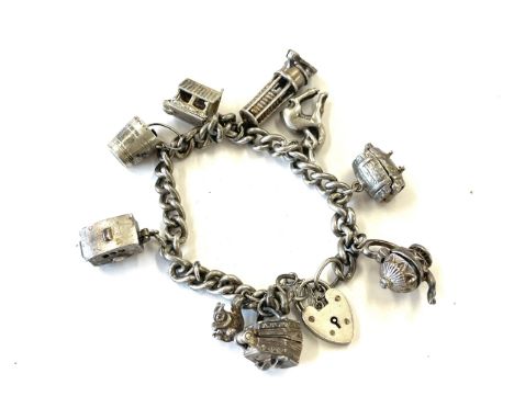 Sterling silver charm bracelet with opening charms 