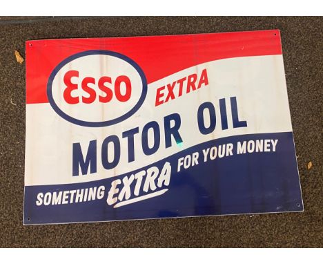 Vintage plastic Esso extra motor oil advertising sign, approximate measurements: 23 inches, Width 33.5 inches 