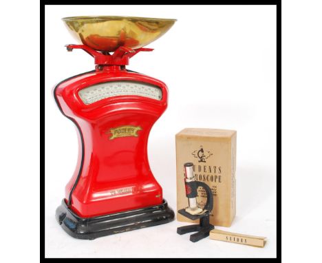 A vintage 20th century set of Pooley cast iron grocers' scales with non associated brass tray in red and black colourway. Tog
