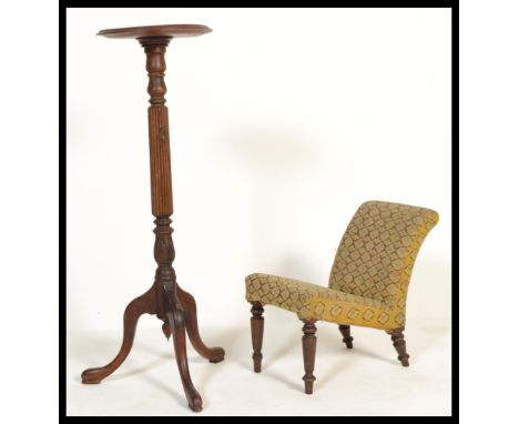 An early 20th Century Edwardian Gout stool with upholstered cover together with an Edwardian tourchere / plant stand raised o