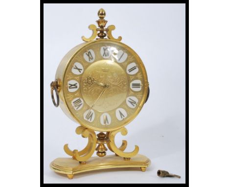 A vintage 20th century Junghans Meister brass cased mantel clock having a gilt dial with faceted hands and Roman numeral chap