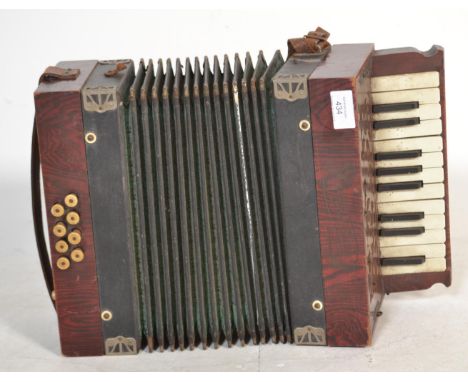 Musical Instruments. A vintage early 20th century  " Tonella " piano accordion in faux rosewood casing. 
