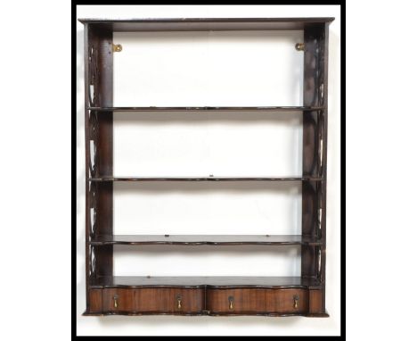 A 1920's Serpentine fronted, lattice worked hanging bookcase shelf / shelves. The lattice worked sides with central shelves w