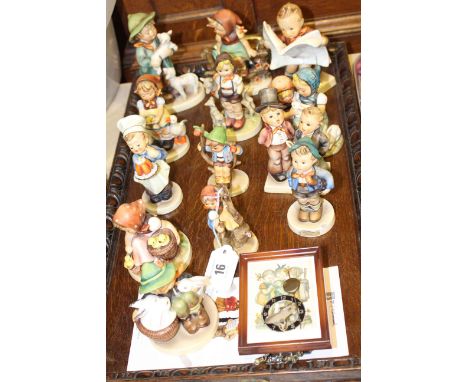 Thirteen Hummel figures and a small clock
