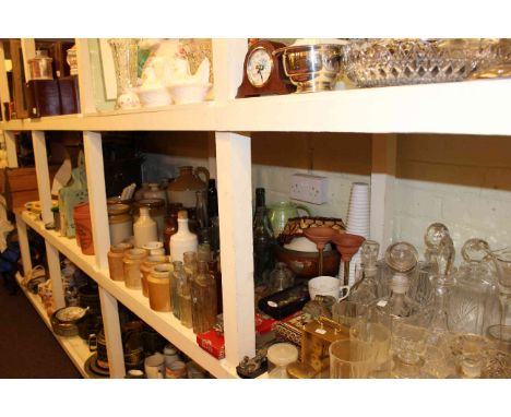 Full shelf of stoneware and glass bottles, glassware, china including Clarice Cliff bowls, corner cupboard and collectables