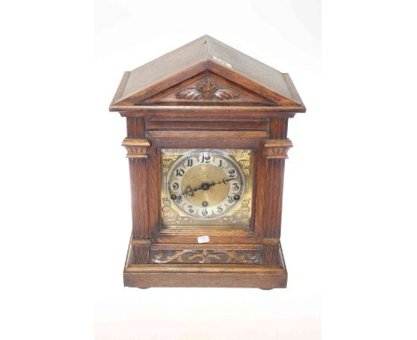 Oak mantel clock with brass and silvered dial