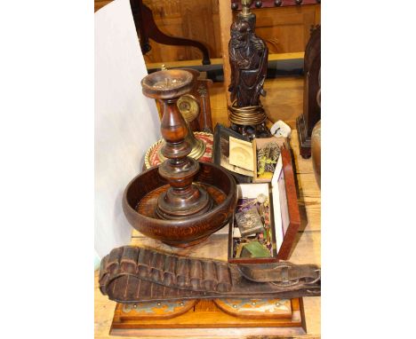 Carved Oriental figure lamp, mantel clock, book trough, hand bell, cartridge belt, boxes of collectables etc.