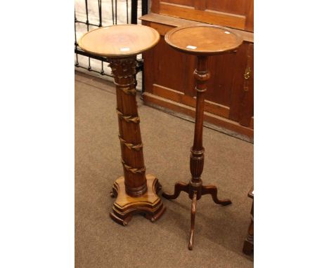 Two mahogany torcheres and pair of lamp tables (2)