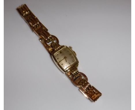A mid 20th Century 14 carat gold cased ladies wrist watch, the dial set with numeral markers and inscribed "DOXA" no'd 822165