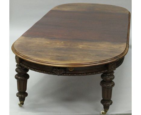 A Victorian Scottish mahogany extending 'D' end dining table and leaf cabinet, the dining table with five leaves and moulded 