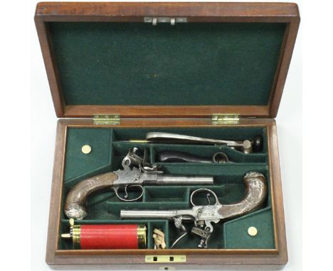 A pair of 18th Century flintlock pocket or travelling pistols by John Manton of London, the walnut grips with silver wire scr