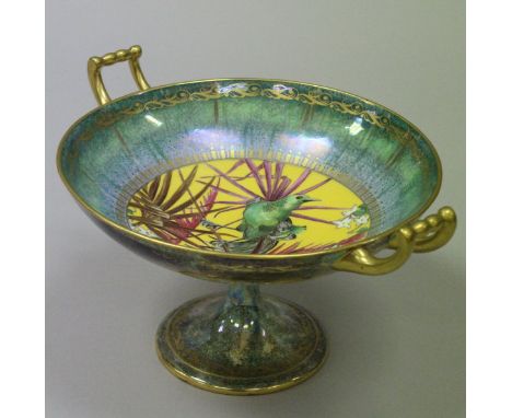 A Minton's lustre ware tazza of Kylix form, the centre field decorated with an exotic bird amongst foliage, 22.6 cm diameter 