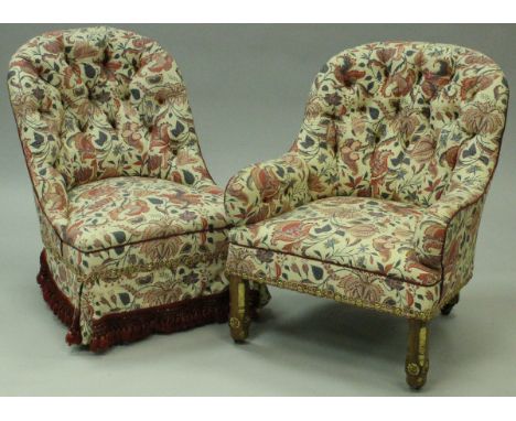Two button back salon chairs with a cream ground foliate patterned upholstery, on square section chamfered legs with gilt hig