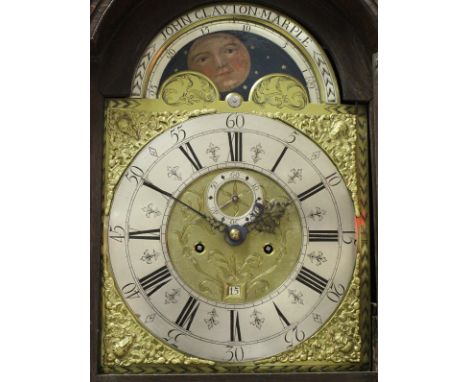 A circa 1750 oak and inlaid oak cased long case clock, the eight day movement with brass arch dial and sun and moon phase, th