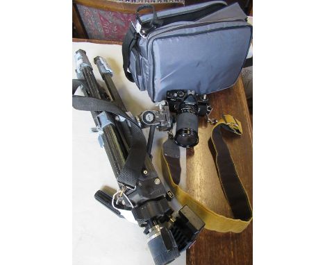 A Cosina CSM camera, together with a Silk 88 Black Diamond tripod