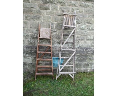 Two wooden step ladders