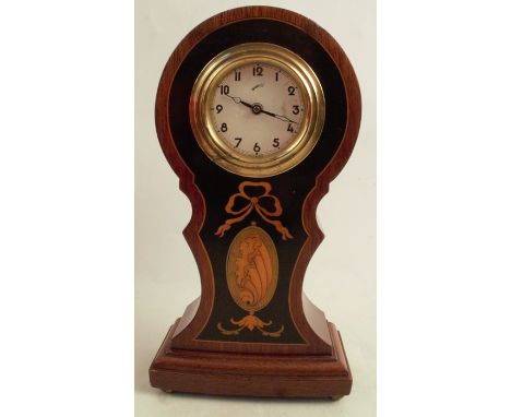 A mahogany cased mantel clock, the dial inscribed Comet, in a balloon case with satinwood inlay, height 8.5ins