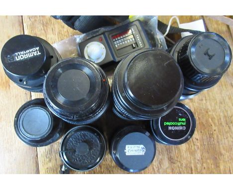 Various camera lenses and a light meter