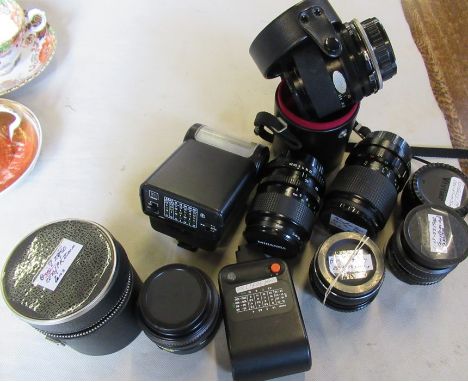 A collection of camera lenses and flashes